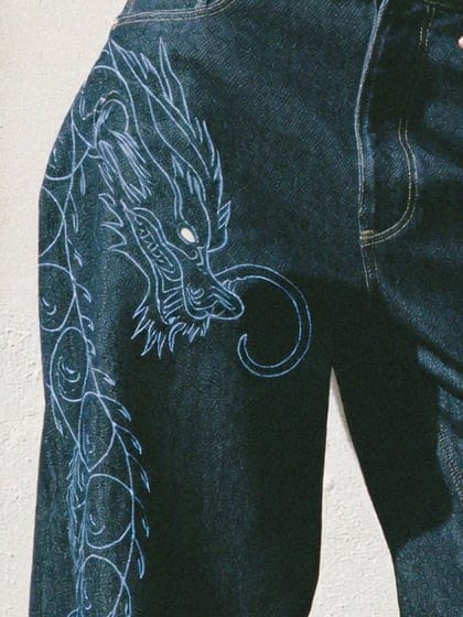 Close view of the chain-stitched dragon head at the hip
